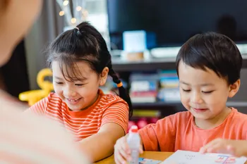 Two children doing a craft activity