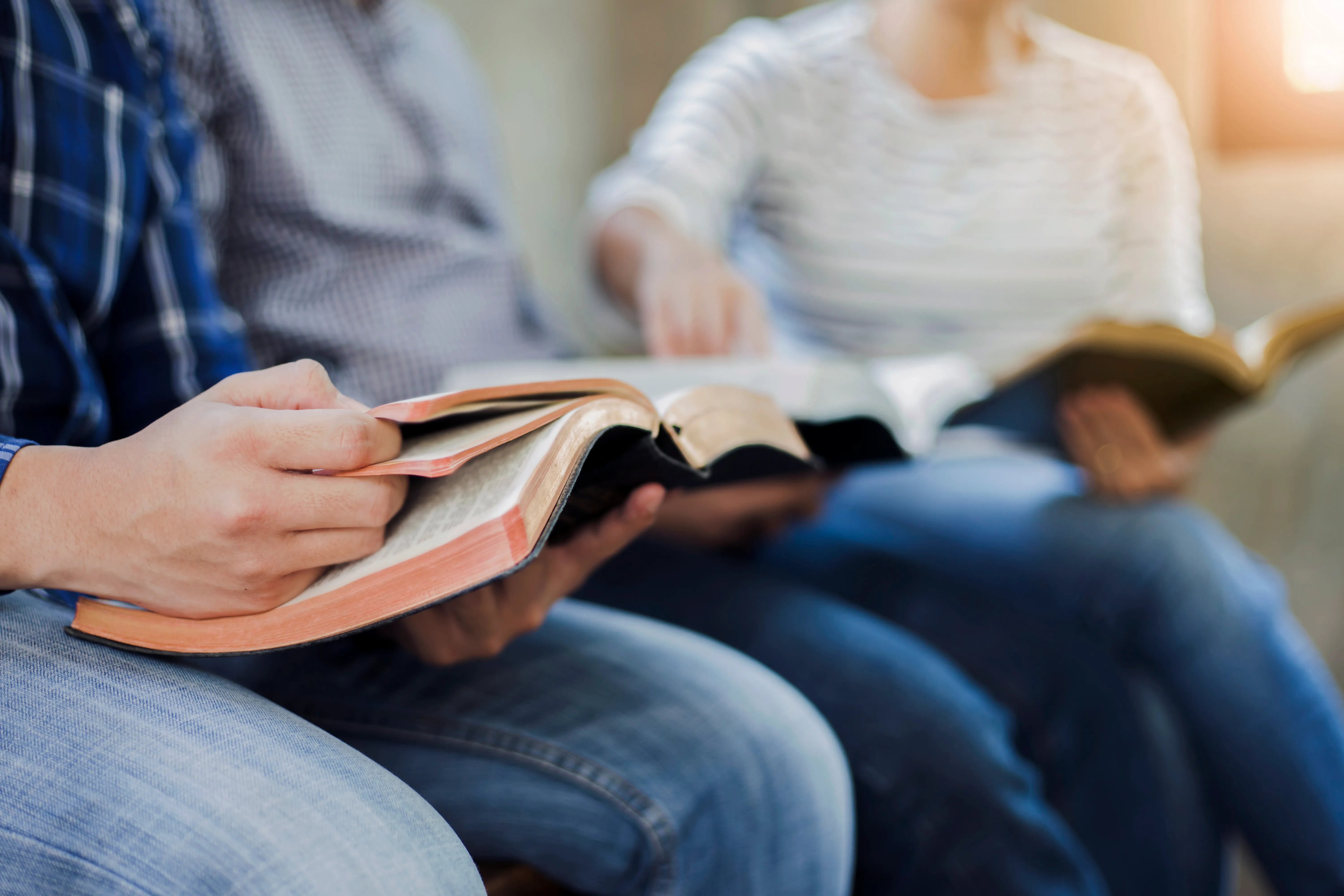 man holding Bible