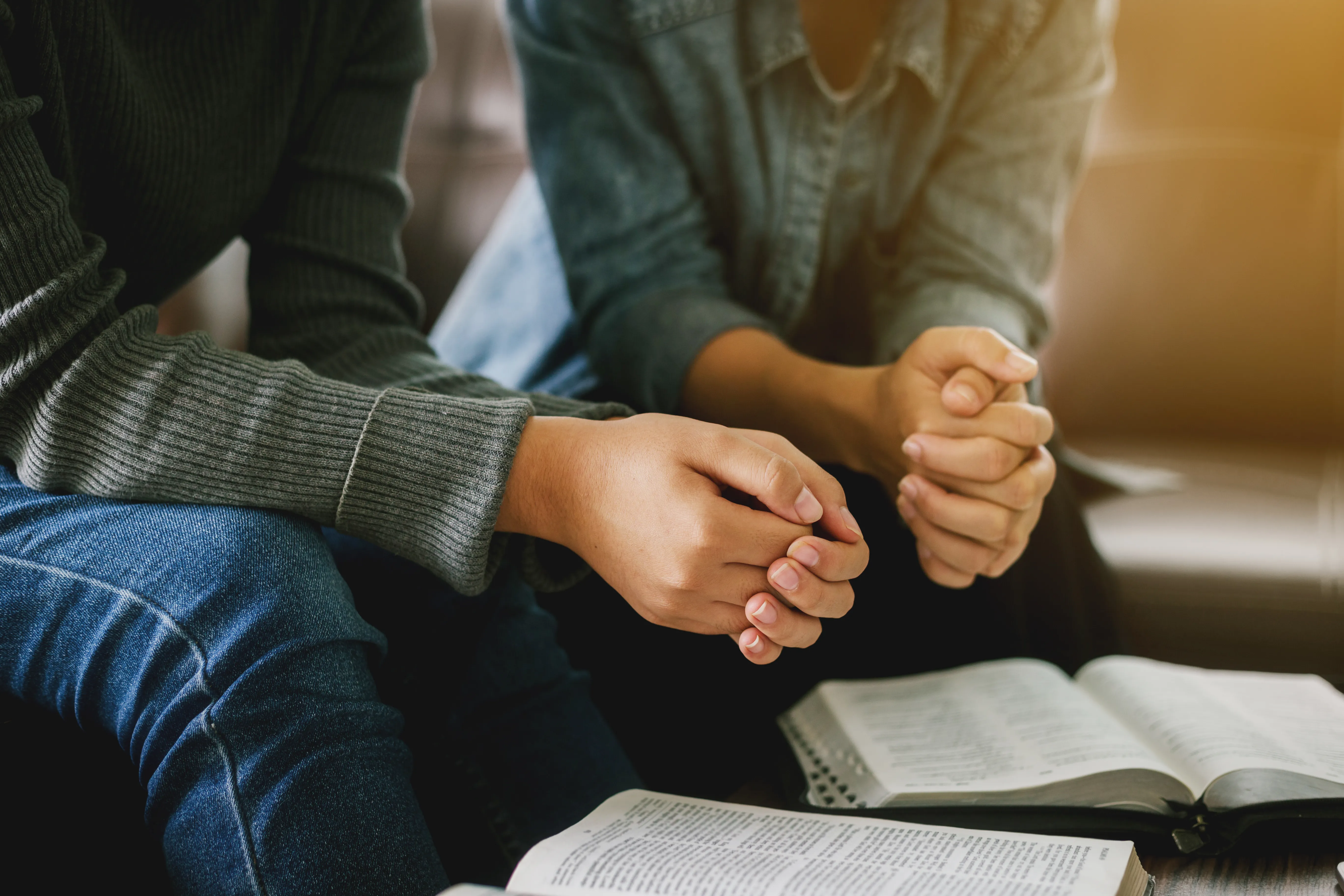 two people praying